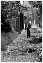 Grain being dried on the street. Dali, Yunnan, China ( black and white)