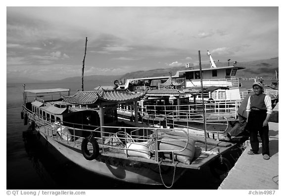 Boats on a pier of Erhai Lake. Dali, Yunnan, China (black and white)