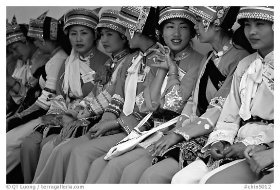 Tour guides dressed with traditional Sani outfits. Shilin, Yunnan, China (black and white)