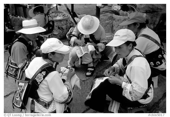 Sani women making embroidery. Shilin, Yunnan, China (black and white)