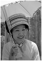 Woman from the Sani branch of the Yi tribespeople with a sun unbrella. Shilin, Yunnan, China ( black and white)