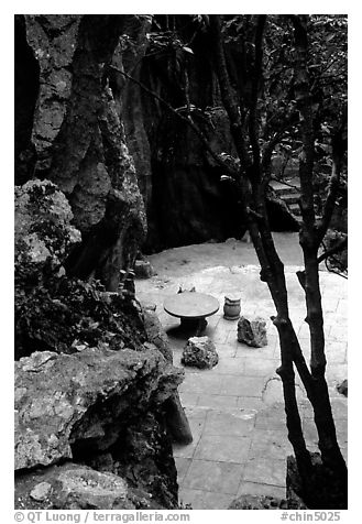 Quiet courtyard between limestone pillars. Shilin, Yunnan, China (black and white)