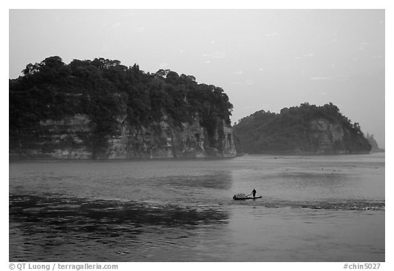 Cliffs of Lingyun Hill and Wuyou Hill at dusk, whose shape evokes a lying buddha. Leshan, Sichuan, China (black and white)