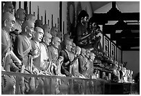 Some of the 1000 individually unique Terracotta arhat monks in Luohan Hall. Leshan, Sichuan, China (black and white)