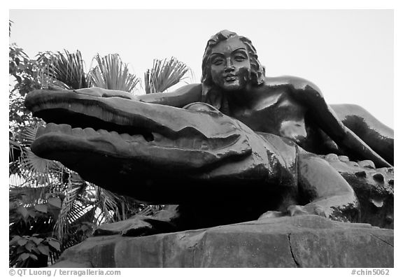 Odd sculpure of a naked woman with a crocodile. Leshan, Sichuan, China (black and white)