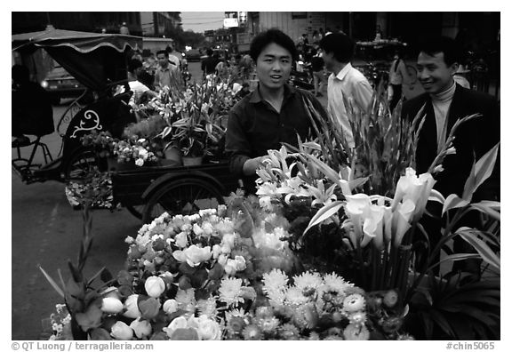 Flower vendor, night market. Leshan, Sichuan, China