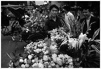 Flower vendor, night market. Leshan, Sichuan, China (black and white)