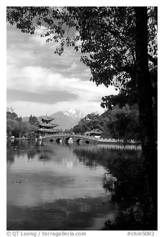 Pavillon reflected in the Black Dragon Pool, with Jade Dragon Snow Mountains in the background. Lijiang, Yunnan, China (black and white)