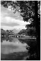 Pavillon reflected in the Black Dragon Pool, with Jade Dragon Snow Mountains in the background. Lijiang, Yunnan, China (black and white)