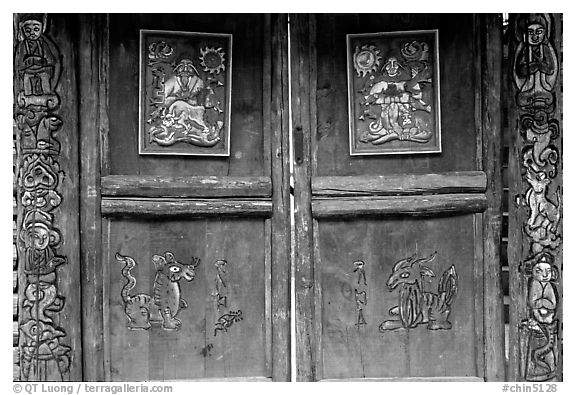 Decorated doors of a temple. Lijiang, Yunnan, China (black and white)