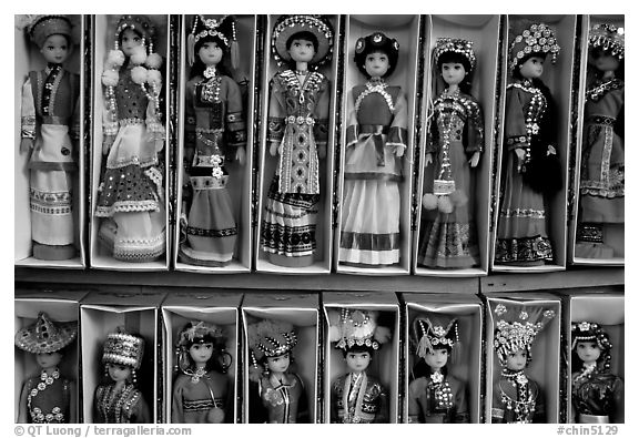 Dolls wearing traditional Bai dress. Lijiang, Yunnan, China (black and white)