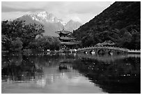 Pavillon and Jade Dragon Snow Mountains reflected in the Black Dragon Pool. Lijiang, Yunnan, China ( black and white)
