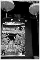 Ming dynasty Wufeng Lou (Five Phoenix Hall), seen through entrance arch. Lijiang, Yunnan, China (black and white)