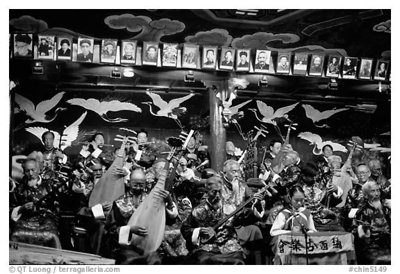 Naxi orchestra in Dayan Naxi concert hall. Lijiang, Yunnan, China (black and white)