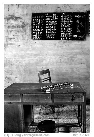 Desk counting frame and Chinese script on blackboard. Emei Shan, Sichuan, China (black and white)