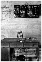Desk counting frame and Chinese script on blackboard. Emei Shan, Sichuan, China (black and white)