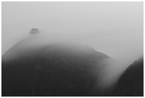 Fog sweaps over Wanfo Ding (Ten Thousand Buddhas Summit) at dusk. Emei Shan, Sichuan, China ( black and white)