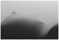 Fog sweaps over Wanfo Ding (Ten Thousand Buddhas Summit) at dusk. Emei Shan, Sichuan, China (black and white)