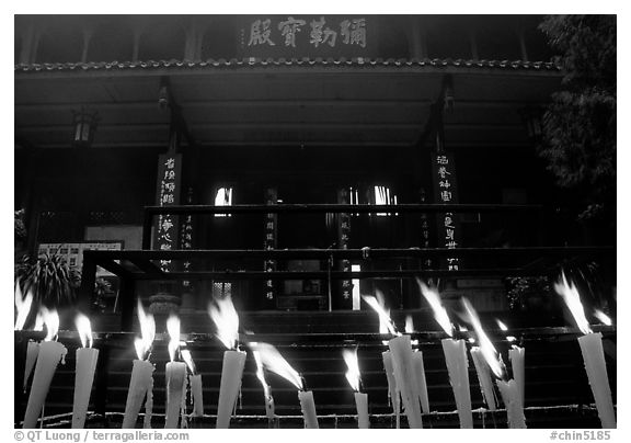 Candles burning in front of Wannian Si temple. Emei Shan, Sichuan, China