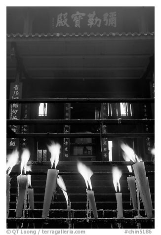 Candles burning in front of Wannian Si temple. Emei Shan, Sichuan, China (black and white)