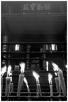 Candles burning in front of Wannian Si temple. Emei Shan, Sichuan, China (black and white)