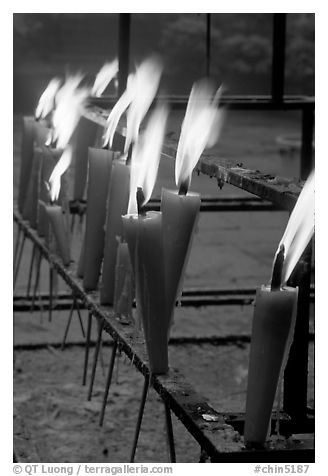 Candles burning. Emei Shan, Sichuan, China (black and white)