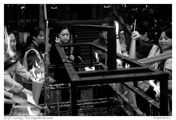 Pilgrims burning big incense batons. Emei Shan, Sichuan, China