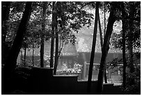 Bailongdong temple seen through trees. Emei Shan, Sichuan, China ( black and white)