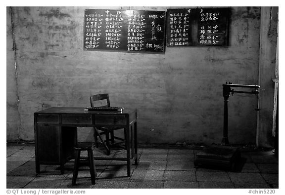 Desk with counting frame, blackboard with Chinese script, scale. Emei Shan, Sichuan, China (black and white)