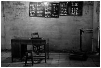 Desk with counting frame, blackboard with Chinese script, scale. Emei Shan, Sichuan, China (black and white)
