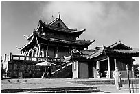 Monk walking in front of Jinding Si temple. Emei Shan, Sichuan, China ( black and white)