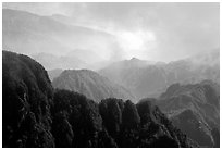 Forest-covered slopes and ridges of Emei Shan. Emei Shan, Sichuan, China (black and white)