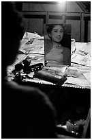 Sichuan opera actress checks her hair in a mirror. Chengdu, Sichuan, China (black and white)