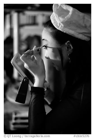 Sichuan opera actress applies makup. Chengdu, Sichuan, China (black and white)