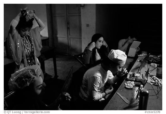 Sichuan opera actors getting ready in the backstage before the performance. Chengdu, Sichuan, China (black and white)