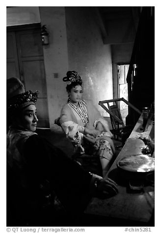 Sichuan opera actors getting ready in the backstage before the performance. Chengdu, Sichuan, China (black and white)