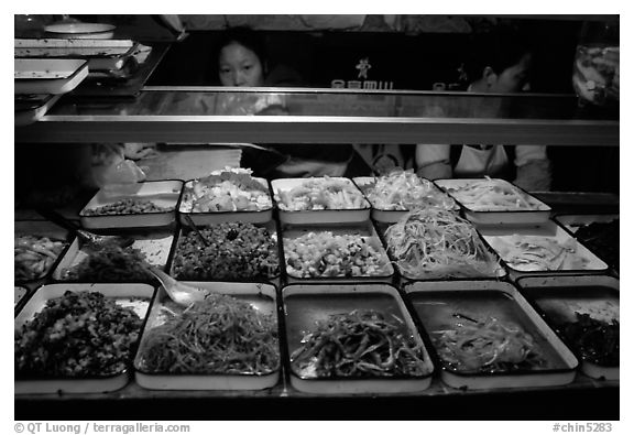 Food stall by night. Sichuan food is among China's spiciest. Chengdu, Sichuan, China