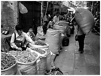 Large bags of dried food items. Guangzhou, Guangdong, China (black and white)