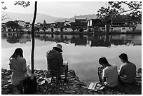 Art students painting along South Lake. Hongcun Village, Anhui, China ( black and white)