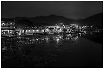 Hongcun village reflected in South Lake at night. Hongcun Village, Anhui, China ( black and white)