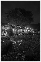 Houses reflected in Nanhu Lake at night. Hongcun Village, Anhui, China ( black and white)