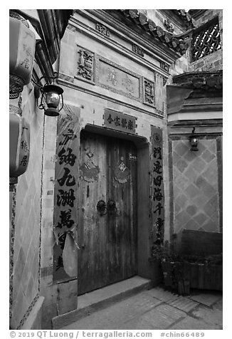 Door with red caligraphed banners. Hongcun Village, Anhui, China (black and white)