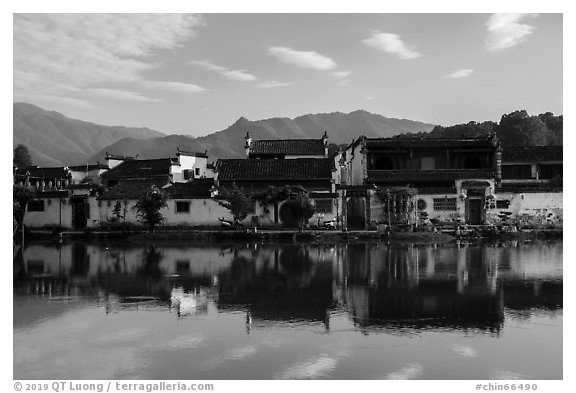 Village reflected in Nanhu Lake, morning. Hongcun Village, Anhui, China (black and white)