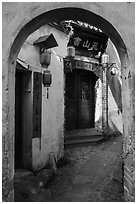 Alley framed by archway. Hongcun Village, Anhui, China ( black and white)