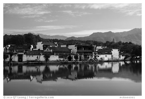 Village reflected in South Lake. Hongcun Village, Anhui, China (black and white)