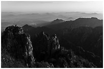 Stone Monkey Watching the Sea view at sunrise. Huangshan Mountain, China ( black and white)