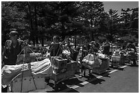 Porters resting heavy loads on pole. Huangshan Mountain, China ( black and white)