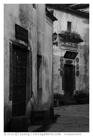 Morning light streaming on walls with lanterns. Xidi Village, Anhui, China (black and white)