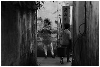 Two women in alley. Xidi Village, Anhui, China ( black and white)