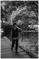 Woman with harvested bunch. Xidi Village, Anhui, China ( black and white)